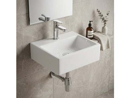 Keramické umývátko Besteco Cubo 43x30 cm v lesklém bílém provedení se středovým otvorem pro baterii.Kód: TR4128