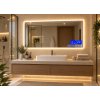 Obdélníkové LED zrcadlo BESTECO Bright 120x65 cm umístěné nad umyvadlem se skříňkou